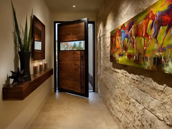 искусственный камень в отделке акцентной стены в дизайне коридора в квартире 