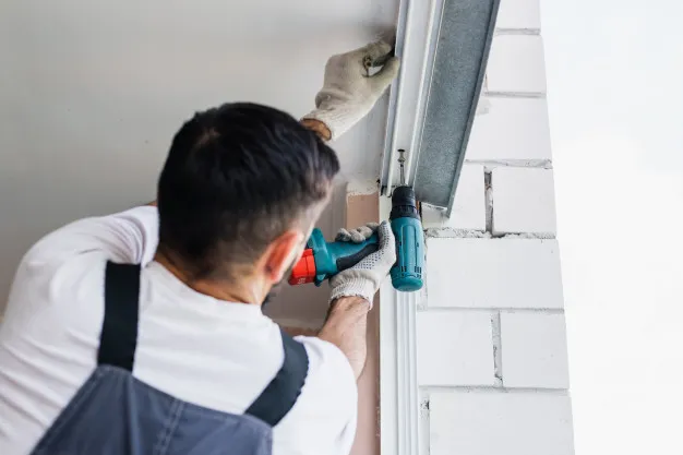 process-of-man-using-screwdriver-worker-makes-the-installation-of-window_77190-2088.jpg