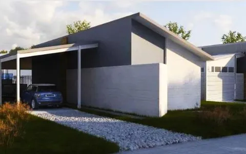 Проект дома с гаражом из пенобетона и навесом для авто