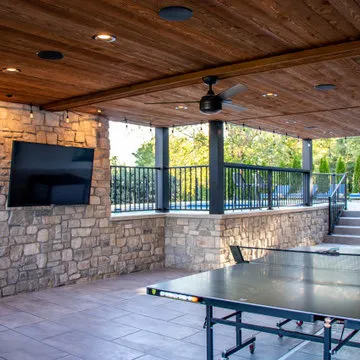 Outdoor Room with a Double Fireplace Feature