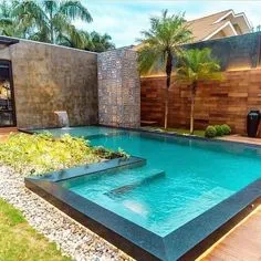 Swimming Pool Designs-- Nothing is extra enjoyable than lounging by a stunning pool and swimming. Most of us have to take a trip for that deluxe but a fortunate couple of have a yard trip including the current pool designs to "staycation" in. #pool#swimmingpool#pooldesigns Landscaping Design